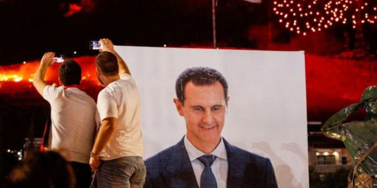 Suriye'de devlet başkanlığı seçimlerini oyların %95,1'ini alan Beşar Esad kazandı, muhalefet seçimler için 'saçmalık' dedi