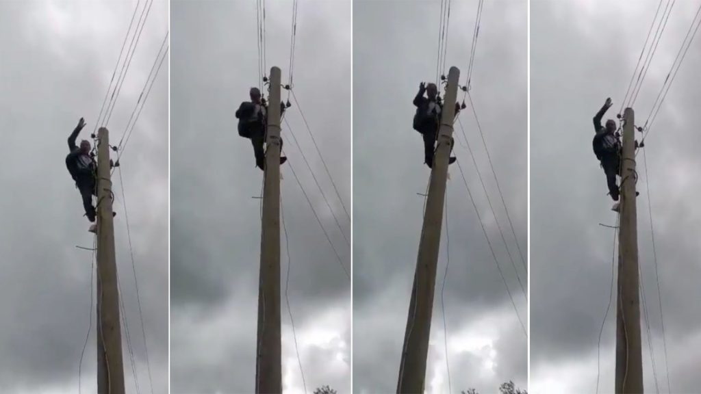 Köy muhtarı elektrik kesintisini protesto için direğe çıktı