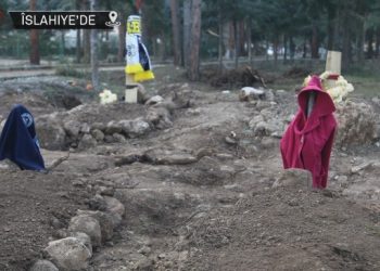 Mezarın altında çocuk, üstünde kıyafetleri