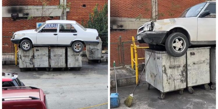 İş yerinin önüne park eden aracı çöpe attılar