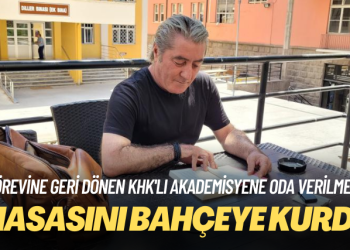Görevine geri dönen akademisyen oda verilmeyince masasını bahçeye kurdu