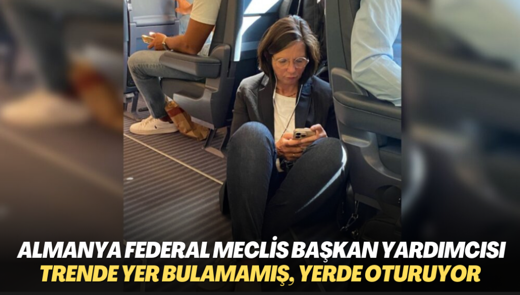 Almanya Federal Meclis Başkan Yardımcısı trende Yer bulamamış, yerde oturuyor