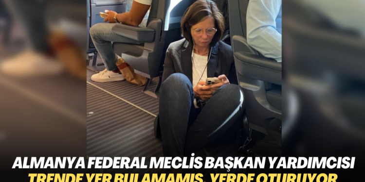 Almanya Federal Meclis Başkan Yardımcısı trende Yer bulamamış, yerde oturuyor